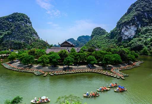 Tourists join boat tours inside the Trang An limestone landscape in Ninh Binh Province, northern Vietnam. Photo by Shutterstock/Anh Hung.